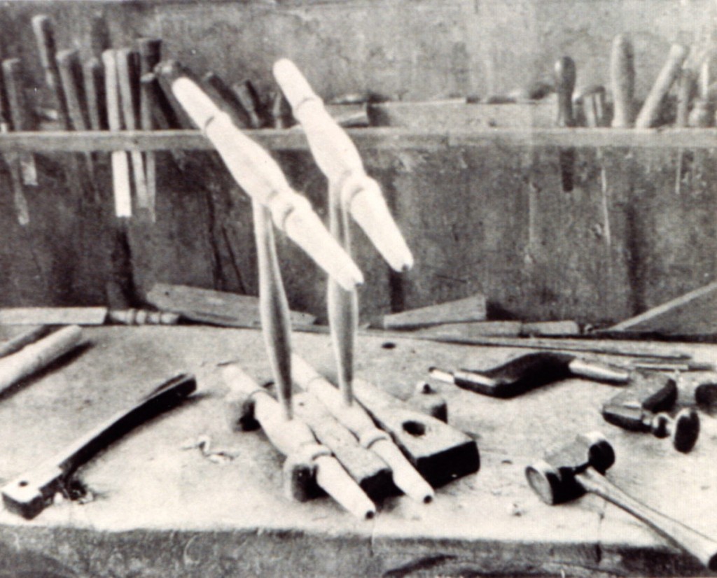 Chair legs and stretchers on a workbench part way through construction