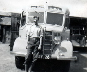 Photograph of Cyril Barrett leaning on the front of Bedford OB coach KGW126 dated 1953