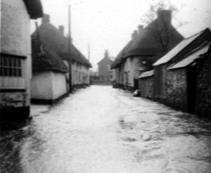 Photograph of floodwater flowing down Castle Street - February 1940