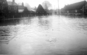 Photograph of flood on South Street taken from area near pond - February 1940
