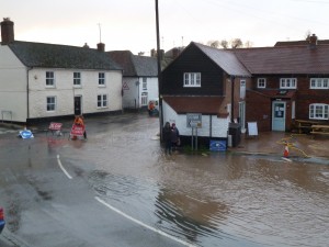 Photograph of flood in the Square looking towards The Junction and West Street -  February 2014