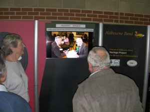 People watching vdeo that was part of the heritage project display